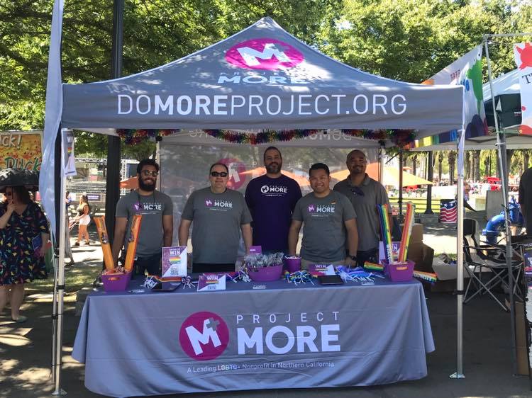 Project MORE team at outreach booth at 2019 Out at the Fair at California State Fair